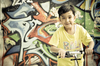 a boy with graffiti background